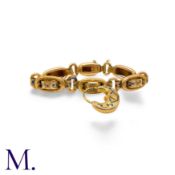 An Antique Gold and Enamel Bracelet with blue and white enamel and padlock charm in 18K yellow gold.