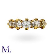 An Old Cut Diamond Five Stone Ring in yellow gold, set with a row of five graduated old cut diamonds