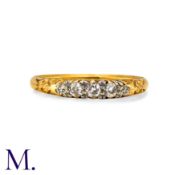 A Diamond Five Stone Ring in 18k yellow gold, the carved body set with five graduated old cut