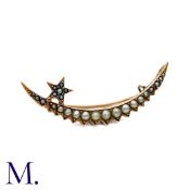 A Pearl Crescent Brooch in yellow gold, of crescent shape and star motif, set throughout with