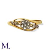 A Diamond Ring in 18k yellow gold and platinum, the stylised band set with a cluster of rose cut