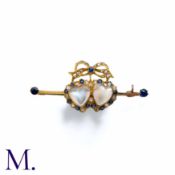 An Antique Moonstone, Sapphire And Diamond Sweetheart Brooch in 15k yellow gold, comprising two