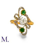 An Art Nouveau Emerald & Diamond Ring in 18K yellow and white gold, set with two emeralds and an old