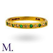 An Emerald & Diamond Half Hoop Ring in 18K yellow gold. Hallmarked. Size: N1/2 Weight: