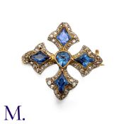 A Sapphire And Diamond Brooch in platinum and yellow gold, in quatrefoil form, set centrally with