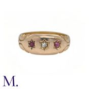 An Antique Ruby and Diamond Gypsy Ring in 18K yellow gold, set with two rubies and a diamond to