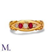 A Ruby And Diamond Five Stone Gypsy Ring in 18k yellow gold, the stylised and set with three round