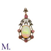 An Antique Opal, Ruby and Diamond Pendant in rose gold and silver, set with a large cabochon opal (