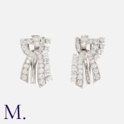 An Art Deco Diamond Double Clip Brooch in platinum, set with round cut and baguette diamonds