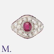 A Ruby and Diamond Ring in platinum, set with an oval cut ruby to the centre, old cut diamonds