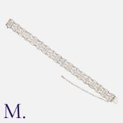 JANESICH. An Art Deco Diamond Bracelet in platinum and white gold, comprising a series of