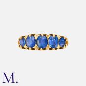A Sapphire Five Stone Ring in 18k yellow gold, set with a row of five graduated oval cut