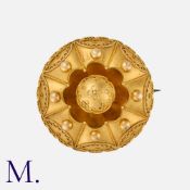 A Victorian, Etruscan Revival Brooch in yellow gold, of domed, circular form, with wirework and