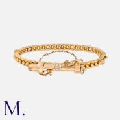 An Antique Pencil Bangle in 9k yellow gold, the hinged, decorative bangle featuring a retractable