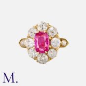 A Burma No Heat Ruby And Diamond Cluster Ring in yellow gold, set with a principal cushion cut