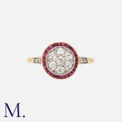 An Art Deco Ruby And Diamond Target Ring in 18k yellow gold, set centrally with a cluster of old cut