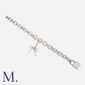 LOUIS VUITTON. An Impressive Padlock Bracelet in 18K white gold, with working characteristic LV