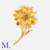 HERMES. A Flower Brooch in 18K yellow gold, signed Hermes Paris and serial numbered. French marks