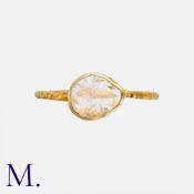 A Diamond Slice Ring in yellow gold, set with a polki diamond slice of approximately 8mm, to a