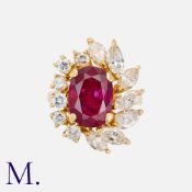A Ruby and Diamond Ring in 18K yellow gold, set with an oval cut ruby weighing approximately 3.