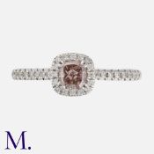 A Fancy Colour Diamond Ring in 18k white gold, set with a principal square modified brilliant