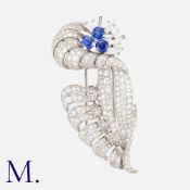 A Fine French Sapphire And Diamond Floral Spray Brooch in 18k white gold, the floral form set