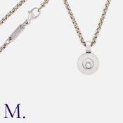 CHOPARD. A Happy Diamond Pendant and Chain in 18ct white gold. The round pendant with floating