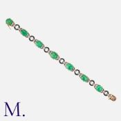 CHAUMET. An Art Deco Emerald, Onyx and Diamond Bracelet in 18K yellow and white gold. Set with