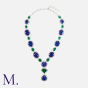 A Tanzanite, Emerald And Diamond Necklace in white gold. set with cabochon emeralds and cabochon