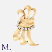 CHAUMET. A 1950s Diamond Clip set in 18ct yellow gold, set with 8 old cut diamonds weighing