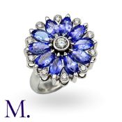 A Spinning Tanzanite And Diamond Ring in 18k white gold, the spinning ring head set with marquise
