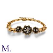 An Antique Blackamoor Bracelet in yellow gold and enamel, with diamond accents. Unmarked but tests