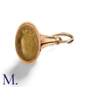 An Antique Fob Seal in yellow gold, set to the base with a carved hardstone intaglio crest. Unmarked