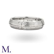 TIFFANY & CO. A Steamerica Band Ring in 18 carat gold, the stylised band set with round cut diamonds