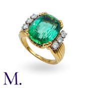 A Mint Tourmaline And Diamond Ring in 18k yellow gold, set with a principal cushion cut tourmaline
