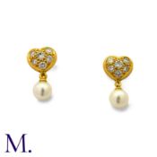 TIFFANY & CO. A Pair of Diamond and Pearl Earrings in 18K yellow gold, with heart form tops set with