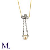 A Pearl And Diamond Bow Pendant Necklace in yellow gold and platinum, the diamond set bow motif