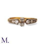 A Diamond Ring in 18k yellow gold, the stylised band set with two principal old cut diamonds, with