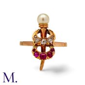 A Ruby Diamond And Pearl Ring in yellow gold, comprising two crescent motifs, one set with rubies,