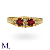 A Spinel And Diamond Ring in 18k yellow gold, set with two red spinel, accented by old cut