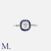 An Old Cut Sapphire And Diamond Target Ring in platinum, set centrally with an old cut diamond of