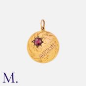 A Mizpah Pendant in 9ct yellow gold, set with a garnet. Size: 20mm Weight: 2.0g