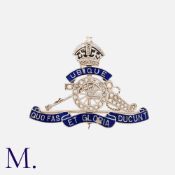 A Royal Artillery Enamel and Diamond Cap Badge in platinum and 18ct gold. Motto of 'Ubique Quo Fas