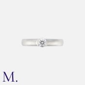TIFFANY & CO. A Diamond Ring in platinum set with a round brilliant cut diamond weighing 0.29ct.