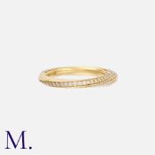 A Diamond Twist Band in 18K yellow gold, set with round brilliant diamonds weighing approximately