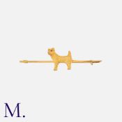 A Scottie Dog Bar Brooch in 9k yellow gold, comprising a sculptural figure of a scottie dog to a