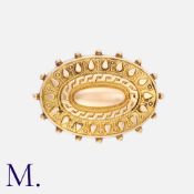 An Antique Mourning Brooch in yellow gold with locket back (glass missing). Tests as 9K gold with