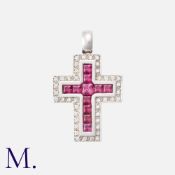 A Rubellite Tourmaline And Cross Pendant in 18k white gold, of crucifix form set with princess cut