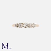 An Old Cut Diamond Five Stone Ring in yellow gold, set with five graduated old cut diamonds.