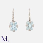 A Pair Of Aquamarine And Diamond Earrings in 14k white gold, each comprising a step cut aquamarine